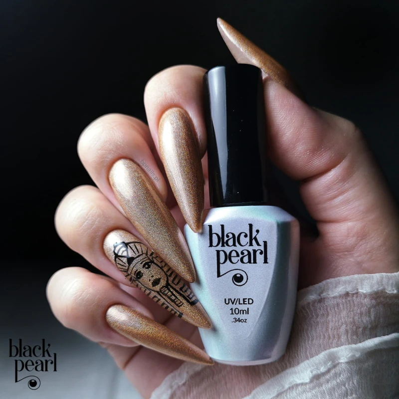 złote paznokcie z drobinkami holograficznymi